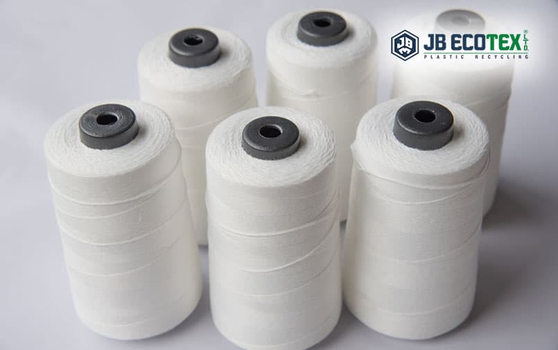 GRS certified recycled polyester staple fibre spools used for high strength sewing thread production