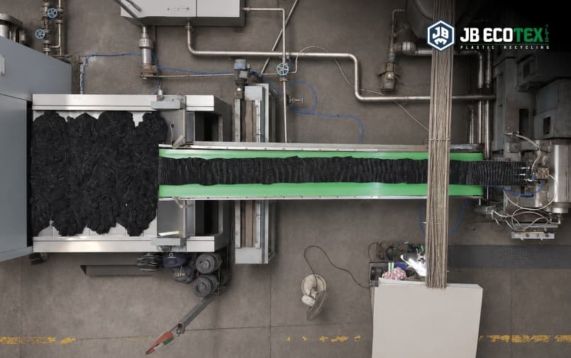 Black recycled polyester fibre production line at the JB Ecotex manufacturing facility